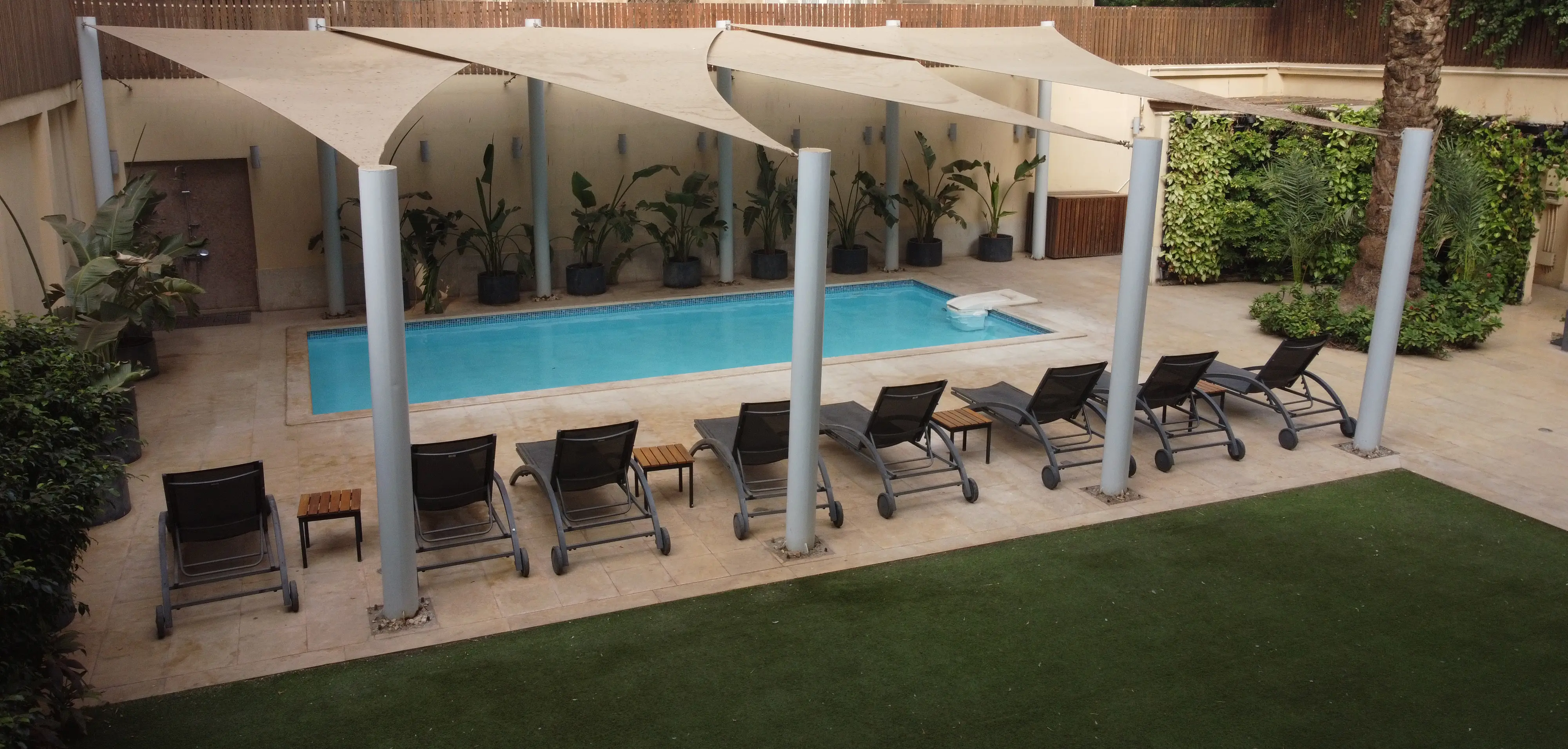 Outdoor swimming pool at Iconia Zamalek Residences