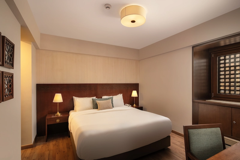 Junior Suite at Iconia Zamalek Residences with modern furnishings and kitchenette